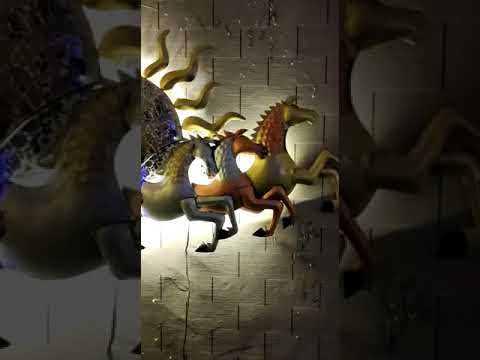 Iron painted 7 horse with sun wall hanging with led. This Iron made painted 7 horses emitting from the Sun which is representing the chariot of the Sun god It is perfect for Indian walls Its dimension is 57 X 33 inches A long-lasting item for home decoration Packed by professionals so it can reach you safely Perfect for bedroom, living room, office, hotel reception, dining room, Board room, Lounge, etc